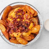 Hag Fries · Seasoned Potato Wedges topped with melted Cheddar Cheese and fresh Breakfast Bacon