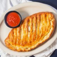 Create Your Own Calzone · Ricotta cheese, mozzarella cheese, and your choice of two toppings. Served with a side of ma...