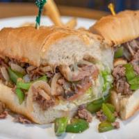 Steak & Cheese Sub · Thinly sliced ribeye steak with American cheese, grilled onions, mushrooms, green peppers, l...