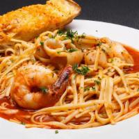 Seafood Linguine · Sautéed shrimp, scallops, clams, calamari in a choice of red, white, or rose sauce. Served w...