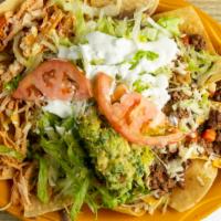 Nachos Supreme · Nachos with melted cheese, ground beef, pulled chicken, refried or black beans, topped with ...