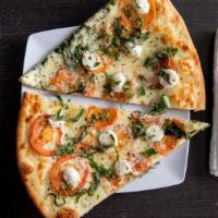Margerita Pizza · Fresh roma tomatoes, basil, buffalo mozzarella, olive oil and fresh garlic sauce.
