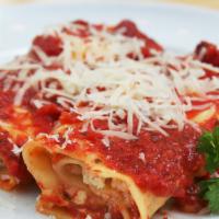 Manicotti · Large tubes of pasta made with creamy cheese. Served with garlic bread and a small salad.