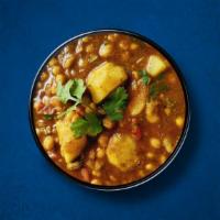 Chickpea Potato Masala · Chickpeas and potatoes, slow-cooked in an onion and tomato curry sauce with Indian whole spi...