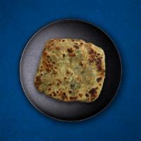 Mint Layered Paratha · Whole wheat bread laced with finely chopped fresh mint leaves, baked over a flat griddle.
