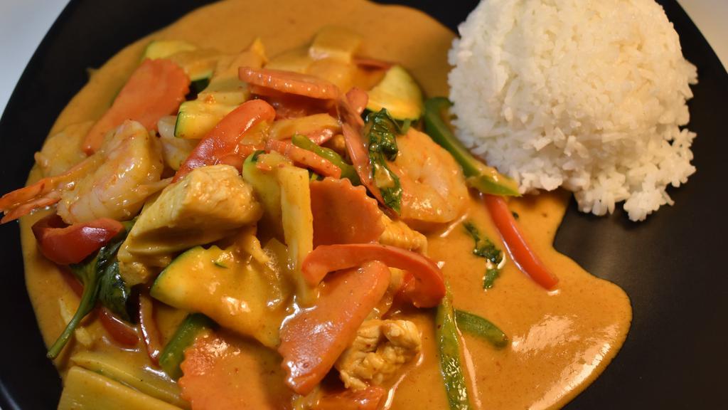 33 Red Curry · Spicy. (w/Rice) Coconut milk based, red chili curry with bell peppers, zucchini, carrots, bamboo shoots and basil.