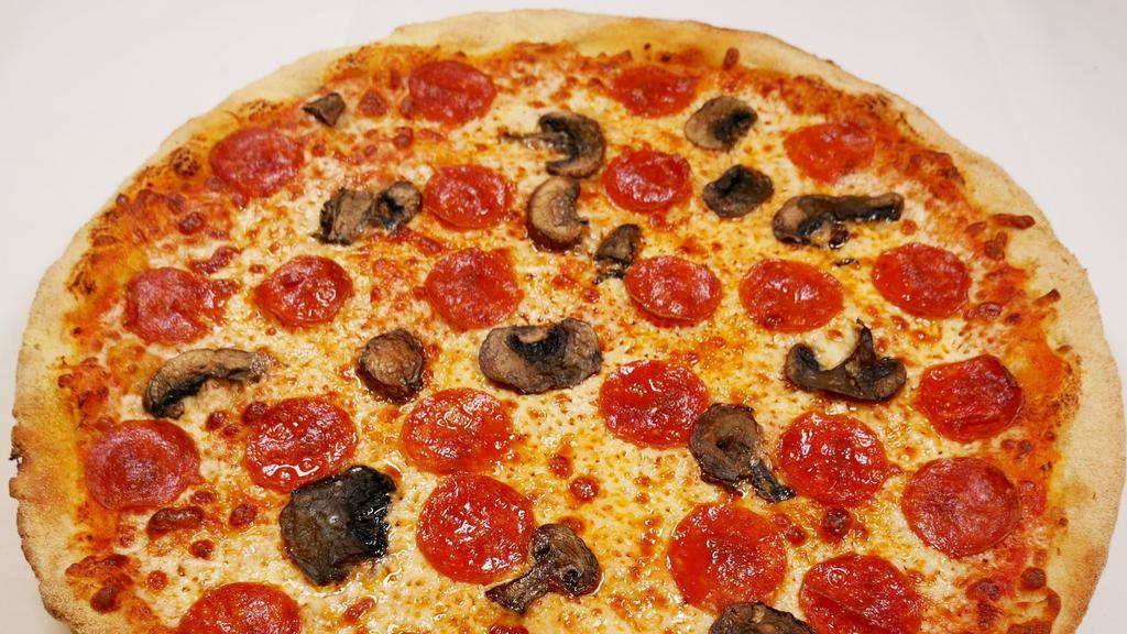 Mushroom & Pepperoni · mushrooms and pepperoni on top of a bed of cheese, tomato sauce, and a perfectly crust! This pizza  is everything that you want it pairs so perfectly.super delicious