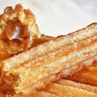 1 Churro · Homemade Churros Dulce de Leche Filled, Toasted with cinnamon sugar mix