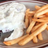 Chicken Fried Steak · Smothered with white gravy or chile con queso.