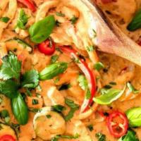 Red Curry · Spicy.  with bamboo shoots, bell pepper and basil leaves and coconut milk.