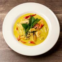 Green Curry · Protein With bamboo shoots, eggplant,  bell pepper and basil leaves and coconut milk.