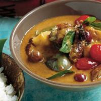 Gaeng Ped (Duck) · Spicy. Rosted duck in red curry with pineapple, tomatoes, string beans basil and coconut milk.