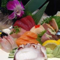 *Sashimi Deluxe · 18 pieces of chef’s choice assorted sashimi and a bowl of rice.