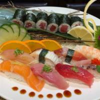 *Sushi Deluxe · 8 pieces of chef’s choice assorted sushi, 1 Tuna roll or 1 California roll.