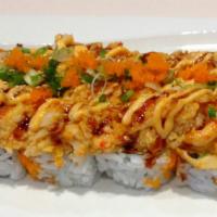 *Volcano Roll · Spicy. Crab stick, cucumber, avocado topped w/ bake spicy seafood salad, spicy mayo, eel sau...
