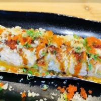 Hot Samurai Roll · Spicy. Baked whole roll. Crab salad, avocado, tempura flakes topped w/ salmon, spicy mayo, e...