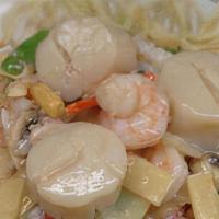 Birds Nest Delicacies 鸟巢 · Shrimp, scallop and crab meat sautéed an special white sauce with assorted vegetables contai...