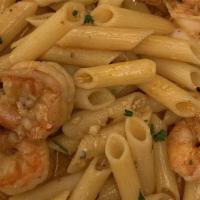 Shrimp Scampi · Gulf shrimp and roasted garlic served over linguini pasta with white wine sauce