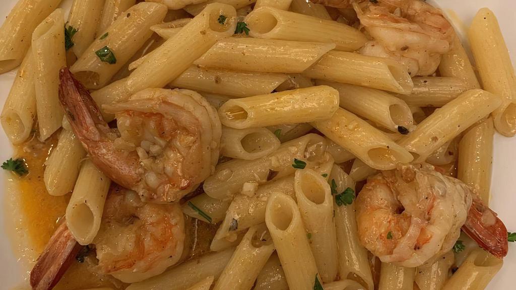 Shrimp Scampi · Gulf shrimp and roasted garlic served over linguini pasta with white wine sauce