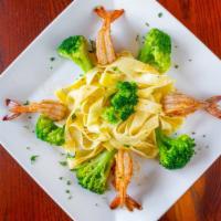 Shrimp & Broccoli Alfredo · Gulf shrimp and broccoli, sautéed in a creamy parmesan alfredo sauce served over fettuccine ...