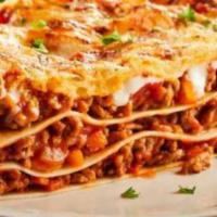 Lasagna Mamma Mia · Homemade pasta baked with ground beef, ricotta, mozzarella and parmesan cheese. Topped with ...