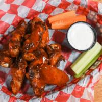 Smoked Chicken Wings By The Lb · Hickory smoked and crisped in the fryer, tossed with house wing sauce. Served with carrots a...