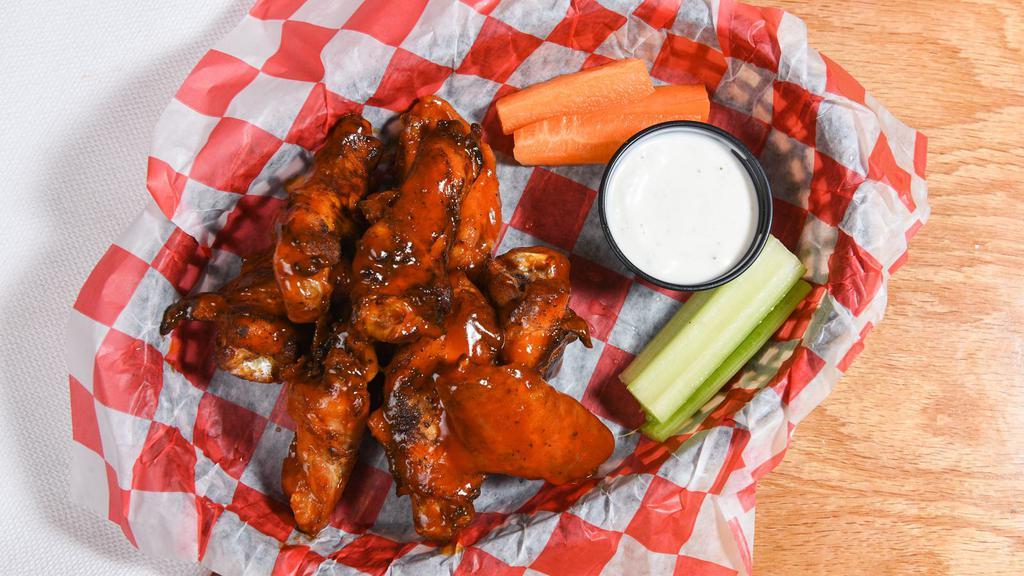 Smoked Chicken Wings By The Lb · Hickory smoked and crisped in the fryer, tossed with house wing sauce. Served with carrots and celery, choice of ranch or blue cheese.