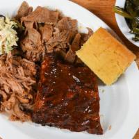 1/4 Rib & Two Meat · Served with slaw topper, cornbread and choice of side