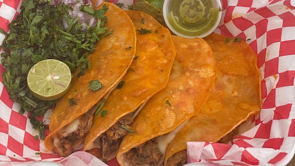 Quesabirria Order · Four corn tortilla taco with cheese, beef birria, onion, and cilantro. Paired on the side with lime and salsa Verde and 6oz consome.