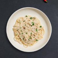 Alfredo Pasta (Spaghetti) · Spaghetti pasta cooked in creamy white sauce topped with parmesan.