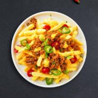 Chili Cheese Fries · Idaho potato fries cooked until golden brown and garnished with salt, melted cheddar cheese,...