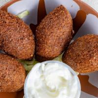 Kibba · Four pieces of crushed wheat stuffed with ground beef, pine nuts and onion fried in extra vi...