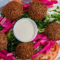 Falafel · Five pieces of patties made with mix of ground split fave beans and checkpeas, onion, garlic...