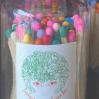 Rainbow Matches · An apothecary jar filled with a rainbow of matches.
