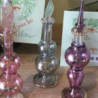 Perfume Bottle · An elegant glass bottle and stopper, perfect for perfumes, essential oils, and other scents.