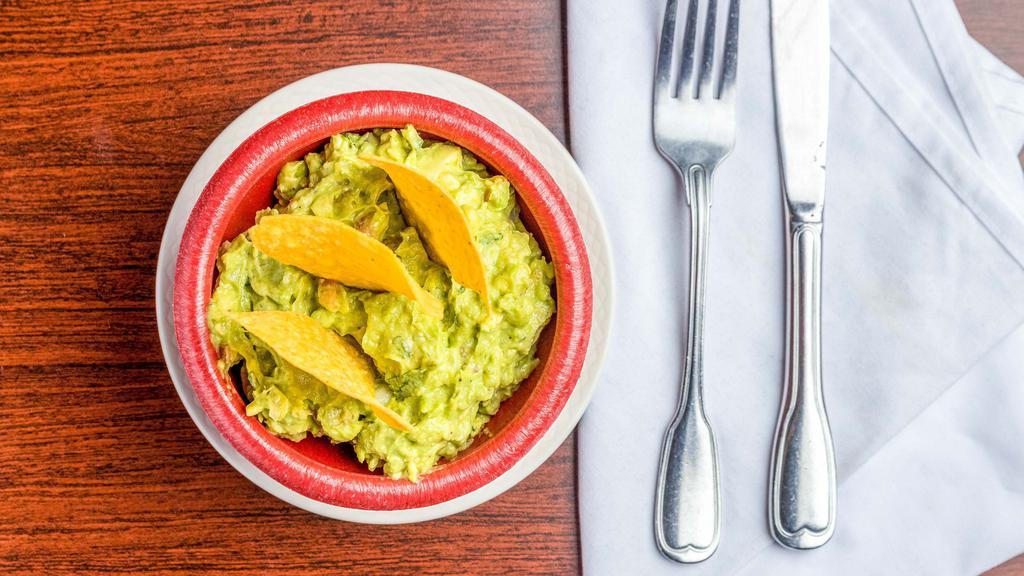Guacamole · Mashed avocado, tomatoes, chopped onions, cilantro and spices.