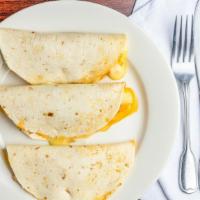 Quesadillas · Soft flour tortillas stuffed with Mexican cheese.