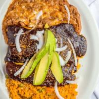 Enchiladas Mole Poblano · Soft tortillas stuffed with cheese, chicken, beef, covered with our special sauce.