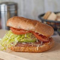 Torta Hawaiana · Toasty, pressed telera roll filled with sliced ham, melty Mexican cheese, peppers and sweet ...