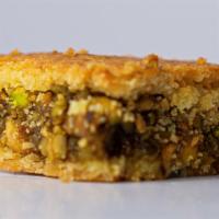 Pistachio Ma'Amoul (By Pound) · Vegetarian. Two layers of our special semolina dough stuffed with premium crushed pistachios.