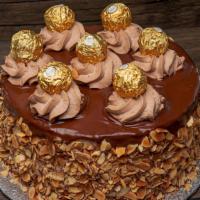 Ferrero Rocher Chocolate Cake · This cake is made of Hazelnut Sponge Cake layers, then sandwiched with Nutella and some wafe...