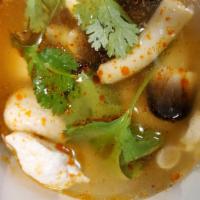 Tom Yum · Spicy. Exotic Thai sour and spicy lemongrass broth with mushroom tomatoes, and cilantro.