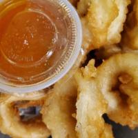 Fried Calamari · Fresh calamari , lightly battered in tempura batter and deep fried. Served with sweet and so...