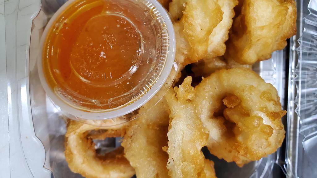 Fried Calamari · Fresh calamari , lightly battered in tempura batter and deep fried. Served with sweet and sour sauce.