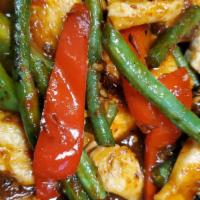 Pad Prik Khing · String beans and bell peppers sauteed with kaffir lime leaves in red curry paste sauce.