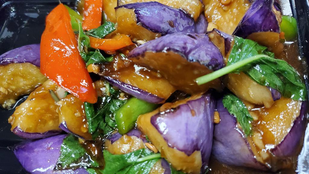 Spicy Eggplant · Vegetarian. sliced Chinese eggplant bell pepper, basil leaves stir-fried with chili-garlic bean sauce.