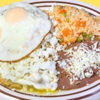 Chilaquiles · Fried tortilla strips simmered in red or green salsa. Served with rice, refried beans, fresc...