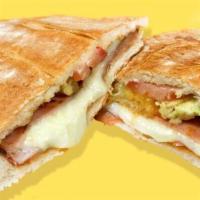Torta Hawaiana · Hawaiian sandwich. Telera bread, stuffed with ham and melted cheese , pineapple, refried bea...