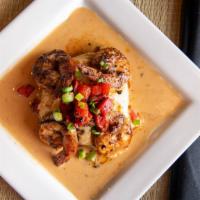 Shrimp & Grits · five jumbo shrimp seasoned with garlic and old bay served with roasted red pepper cheese gri...