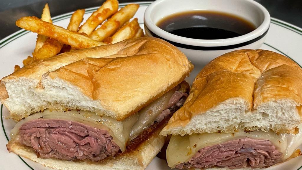 Balboa · Shaved roast beef and melted provolone on toasted garlic bread with au jus and crispy fries.